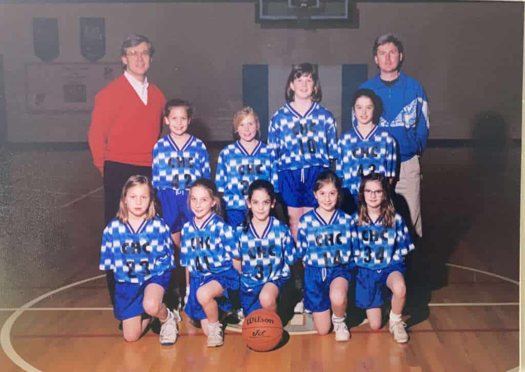 Photo of a young Mary on a basketball team towering over the other girls